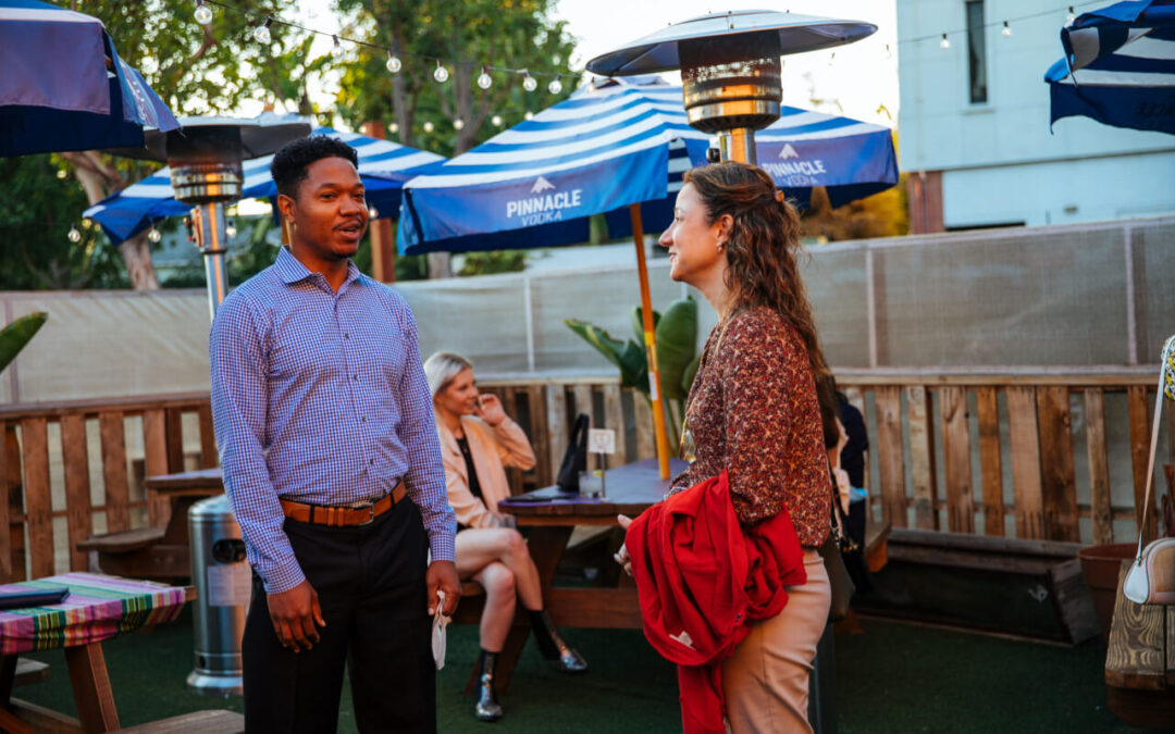 a man and woman talking to each other